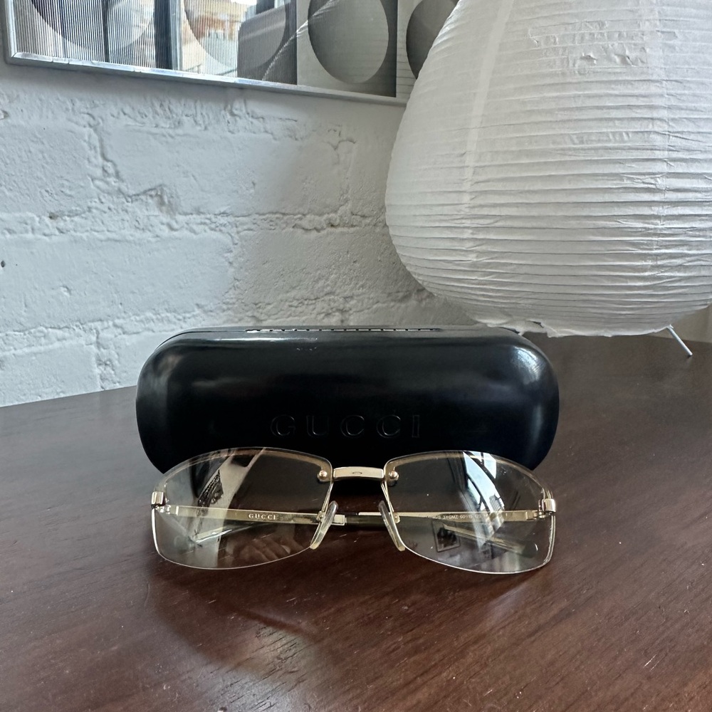 Gucci Gold and Black Rimless Eyewear